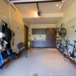 Vail-Mountain-Elegant-custom-garage-floor-with-cabinets-and-slat-wall-organizers